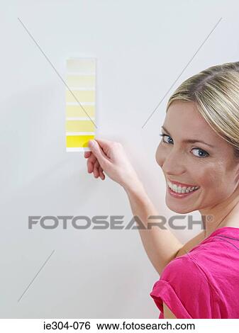 A woman holding a colour chart View Large Photo Image Stock Photograph - A woman holding a colour chart. Fotosearch