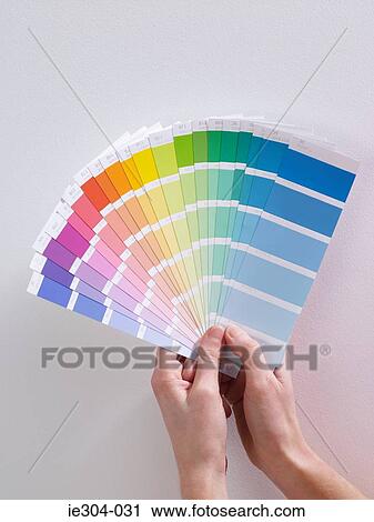 A woman holding colour charts View Large Photo Image Stock Image - A woman holding colour charts. Fotosearch