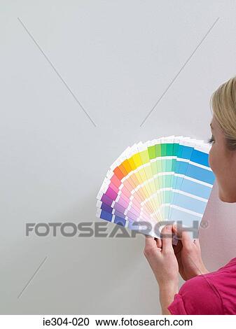 A woman looking at colour charts View Large Photo Image Stock Image - A woman looking at colour charts. Fotosearch