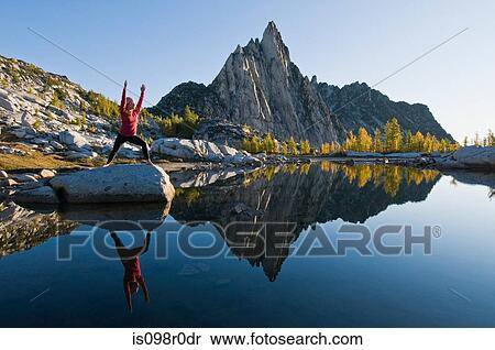 Stock Photography - A woman practising yoga. Fotosearch