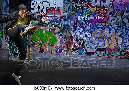 A young man kicking View Large Photo Image Stock Photo - A young man kicking. Fotosearch
