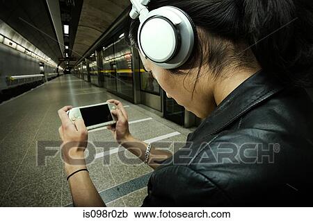 A young man playing a video game View Large Photo Image Stock Image - A young man playing a video game. Fotosearch