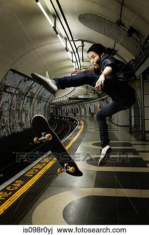 A young man skateboarding View Large Photo Image Stock Image - A young man skateboarding. Fotosearch