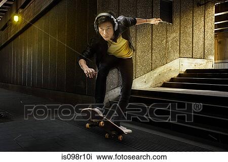 A young man skateboarding View Large Photo Image Stock Image - A young man skateboarding. Fotosearch