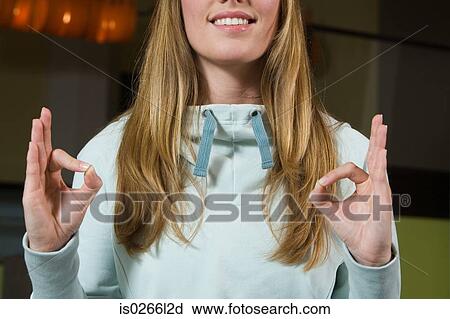 Stock Image - A young woman meditating. Fotosearch