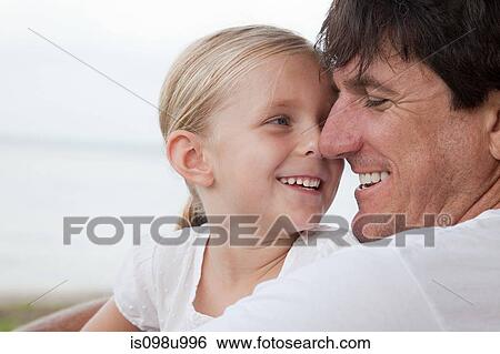 Stock Photograph - Affectionate father and daughter. Fotosearch