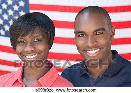 Picture - African american couple and flag. Fotosearch