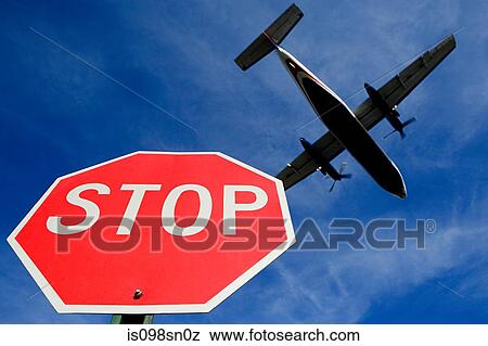 Airplane and stop sign View Large Photo Image Stock Photo - Airplane and stop sign. Fotosearch