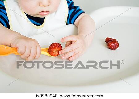 Baby eating strawberries View Large Photo Image Stock Photo - Baby eating strawberries. Fotosearch