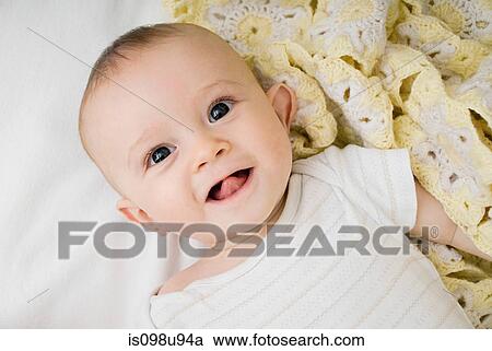 Baby lying on back View Large Photo Image Stock Image - Baby lying on back. Fotosearch