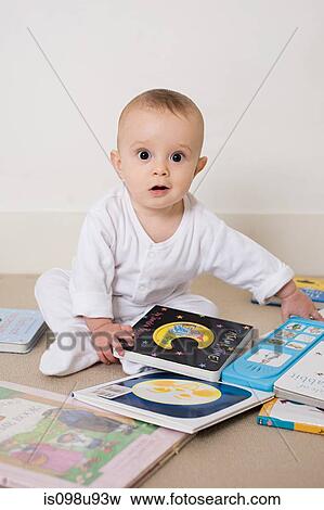 Baby with books View Large Photo Image Stock Photo - Baby with books. Fotosearch