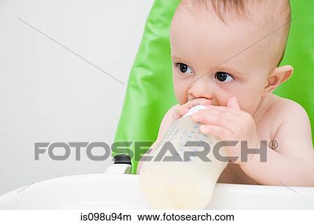 Picture - Baby with bottle. Fotosearch