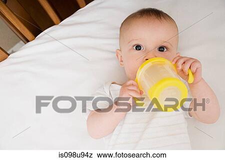 Stock Photo - Baby with bottle. Fotosearch