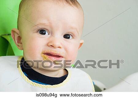 Baby with food round his mouth View Large Photo Image Stock Image - Baby with food round his mouth. Fotosearch