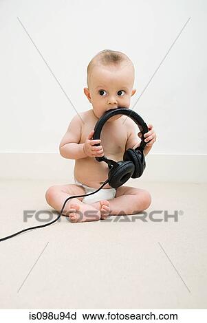 Baby with head phones View Large Photo Image Stock Image - Baby with head phones. Fotosearch