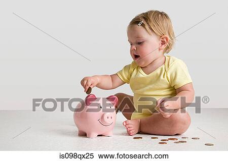 Stock Photography - Baby with piggy bank. Fotosearch