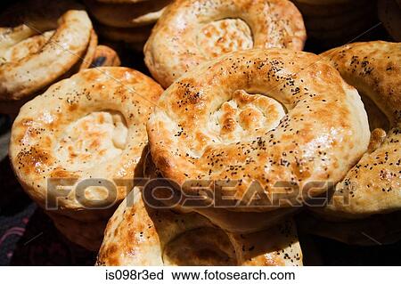 Stock Image - Baked bread in market stall. Fotosearch