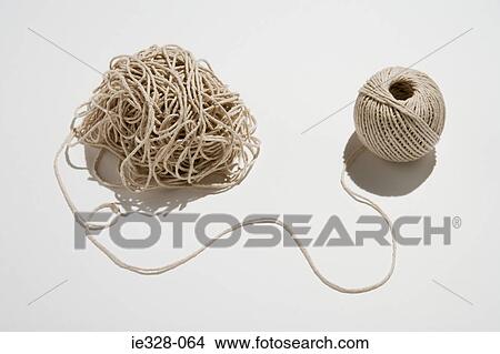 Picture - Ball of twine unraveling. Fotosearch