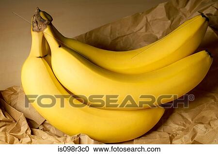 Stock Image - Bananas on brown paper bag. Fotosearch