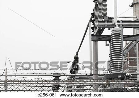 Stock Image - Barbed wire and transformer. Fotosearch