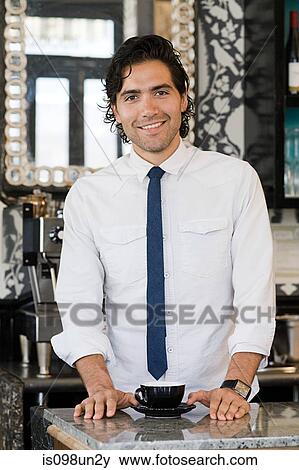 Stock Photo - Barista at coffee shop. Fotosearch
