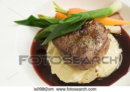 Beef with dauphinoise potatoes and vegetables View Large Photo Image Picture - Beef with dauphinoise potatoes and vegetables. Fotosearch