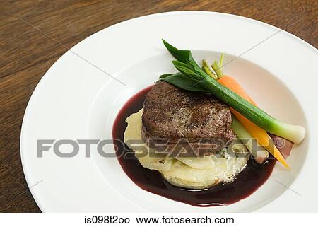 Beef with dauphinoise potatoes and vegetables View Large Photo Image Picture - Beef with dauphinoise potatoes and vegetables. Fotosearch