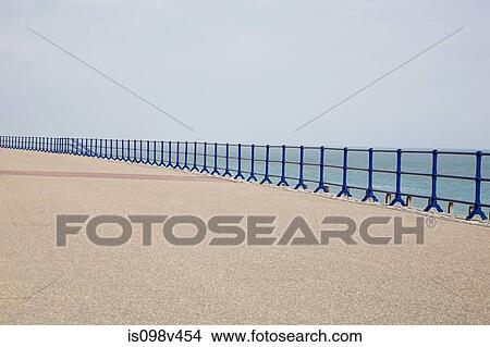 Blue railings and promenade View Large Photo Image Picture - Blue railings and promenade. Fotosearch