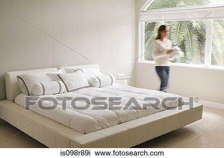 Blurred woman in a bedroom View Large Photo Image Stock Image - Blurred woman in a bedroom. Fotosearch