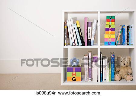 Stock Photography - Book shelves with books and toys. Fotosearch