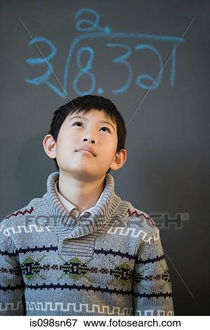 Stock Photo - Boy and blackboard. Fotosearch