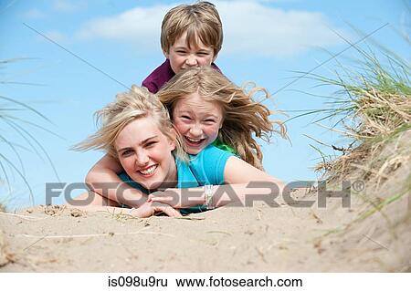 Boy and girl sitting on older sister View Large Photo Image Stock Photograph - Boy and girl sitting on older sister. Fotosearch