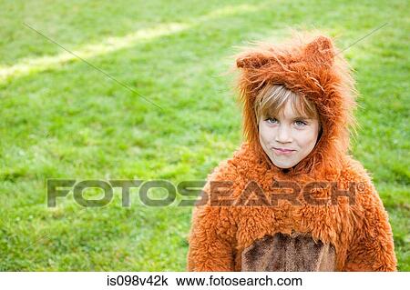 Stock Image - Boy dressed up as bear. Fotosearch