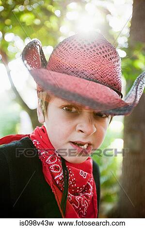 Stock Photo - Boy dressed up as cowboy. Fotosearch