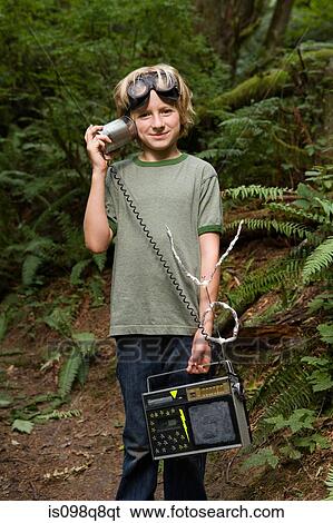 Boy outdoors with radio View Large Photo Image Stock Photograph - Boy outdoors with radio. Fotosearch