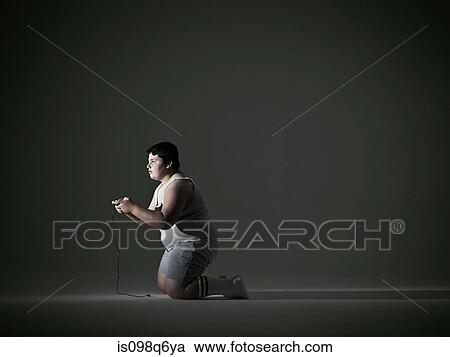 Boy playing video game View Large Photo Image Stock Image - Boy playing video game. Fotosearch