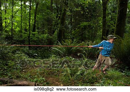Stock Image - Boy pulling rope. Fotosearch