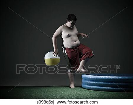 Boy stepping into paddling pool View Large Photo Image Stock Image - Boy stepping into paddling pool. Fotosearch