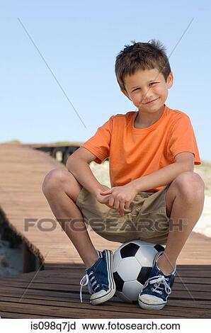 Boy with a football View Large Photo Image Stock Image - Boy with a football. Fotosearch