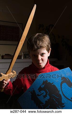 Boy with toy sword and shield View Large Photo Image Picture - Boy with toy sword and shield. Fotosearch