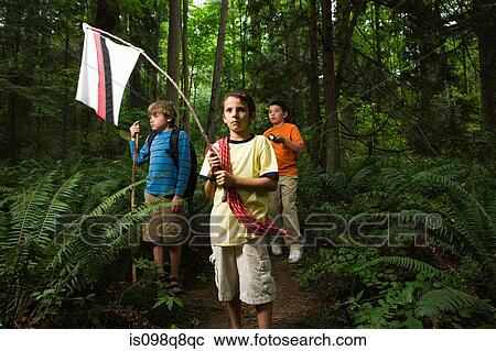 Stock Image - Boys in forest. Fotosearch