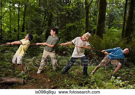 Stock Photograph - Boys pulling rope. Fotosearch