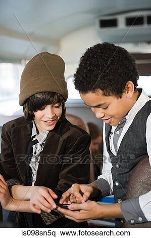 Boys with mp3 player View Large Photo Image Stock Photography - Boys with mp3 player. Fotosearch
