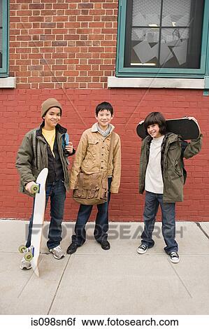 Stock Image - Boys with skateboards. Fotosearch