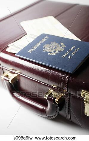 Briefcase tickets and a passport View Large Photo Image Stock Photo - Briefcase tickets and a passport. Fotosearch