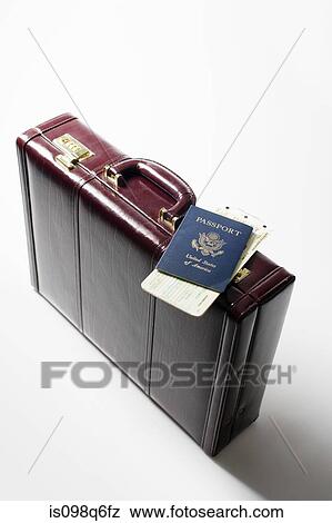 Briefcase tickets and a passport View Large Photo Image Stock Photo - Briefcase tickets and a passport. Fotosearch