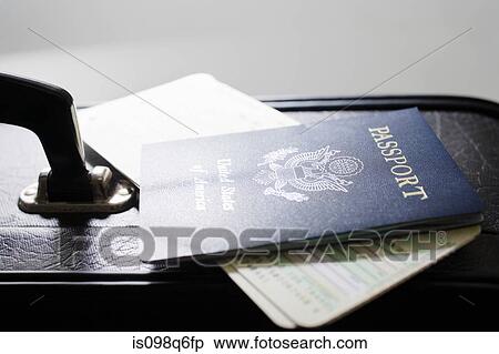 Briefcase tickets and a passport View Large Photo Image Stock Photography - Briefcase tickets and a passport. Fotosearch
