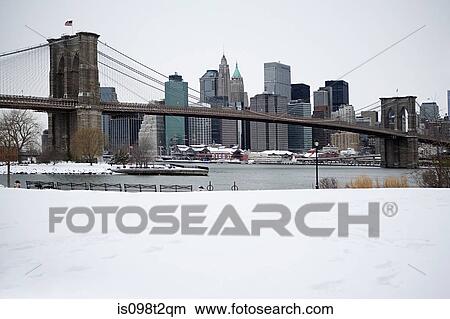 Picture - Brooklyn bridge and manhattan buildings in the snow. Fotosearch