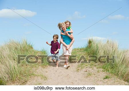 Brother and sisters going to the beach View Large Photo Image Stock Photography - Brother and sisters going to the beach. Fotosearch