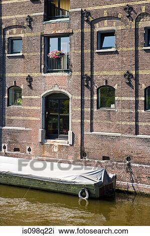 Stock Image - Building and canal in amsterdam. Fotosearch